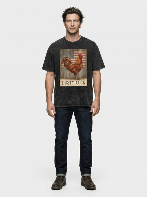 Man wearing a black t-shirt with a rooster graphic and 'Dusty Cock' text on a white background